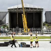 Preparations take place ahead of Ariana Grande\'s One Love Manchester concert, at the Emirates Old Trafford cricket ground, in Manchester, England on Thursday. Grande announced Tuesday that she and other top stars &#8212; including Justin Bieber, Coldplay and Miley Cyrus &#8212; will return to the city to perform at a benefit concert on Sunday. | AP