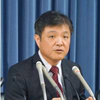 Makoto Okada, a professor at Ibaraki University, speaks during a news conference Wednesday in Tokyo. | KYODO
