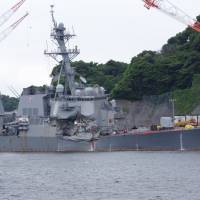 The damaged USS Fitzgerald is seen at the U.S. naval base in Yokosuka, Kanagawa Prefecture, on Sunday ahead of a news conference by the U.S. Navy. U.S. Navy confirms deaths of all seven missing USS Fitzgerald crew