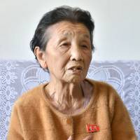 Ruriko Arai, a war-displaced Japanese woman still living in North Korea, is seen speaking to the Japanese media at her home in the eastern coastal city of Hamhung in April. | KYODO
