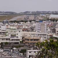 MV-22 Ospreys are seen at Marine Corps Air Station Futenma in Ginowan, Okinawa, in a file photo from 2014. Okinawa to file fresh lawsuit next month against work to replace Futenma base