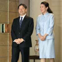 Crown Prince Naruhito leaves his residence in Tokyo for a weeklong visit to Denmark as Crown Princess Masako sees him off. | POOL /VIA KYODO