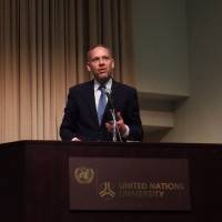 Dirk Hebecker, representative of the Office of the U.N. High Commissioner for Refugees in Tokyo, speaks at a symposium in the capital on Tuesday. | DAISUKE KIKUCHI