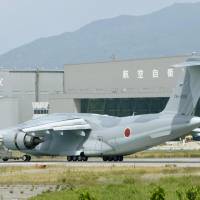 An Air Self-Defense Force C-2 transport that deviated from its takeoff path Friday is seen at Yonago Airport in Tottori Prefecture, where the ASDF\'s Miho base is located. | KYODO