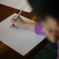 A nine-year-old girl who spent more than three months in a temporary shelter in Tokyo is pictured at her psychotherapist\'s office in Tokyo on March 17. | REUTERS