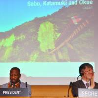 U.N. Educational, Scientific and Cultural Organization members give a round of applause Wednesday at the agency\'s headquarters in Paris after it was decided to add the Tone River basin north of Tokyo and a mountain range in the country\'s southwest to the list of biosphere reserves. | KYODO