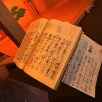 Learning her lines: Ruri Sakamoto holds up a noh script for examination in her basement, which houses a full stage modeled after that of the National Noh Theater. A visit to a preschool leads to lessons in noh and nothingness in Higashi-Gotanda