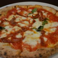 Hot fire: Da Yuki\'s Diavola pizza includes tōgarashi peppers, spicy salami, mozzarella, basil and parmesan cheese. | J.J. O\'DONOGHUE