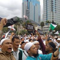Protesters demonstrate in March against Jakarta Gov. Basuki Tjahaja Purnama, a Christian who was arrested on blasphemy charges and subsequently convicted and jailed. | CAHAYA MAULIDIAN