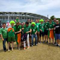 Ireland rugby fans enjoy the atmosphere outside Ecopa Stadium in Shizuoka before their team\'s 50-22 win over Japan on Saturday. | ANDREW MCKIRDY