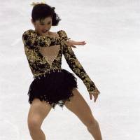 Kristi Yamaguchi competes in the free skate at the 1992 Olympics in Albertville, France. Yamaguchi won the gold medal and captured her second senior world title the following month. | AP