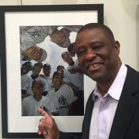 Warren Cromartie points to a picture of himself with the Japan Samurai Bears, who he managed in 2005, last week at Tokyo Metropolitan Central Library. Former Yomiuri star Cromartie still feels at home in Japan