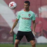 Portugal\'s Cristiano Ronaldo, seen here at a training session in Kazan, Russia, on Friday, is reportedly ready to leave Real Madrid. | AP