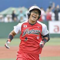 Japan\'s Yu Yamamoto celebrates after hitting a seventh-inning grand slam in Sunday\'s 5-3 win over the United States at Yokohama Stadium. | KYODO