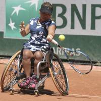 Yui Kamiji returns the ball during her French Open final match against Germany\'s Sabine Ellerbrock on Saturday. | AP