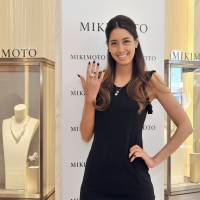 Model Izumi Mori poses with a ring at a press preview of the opening of Mikimoto\'s main store in Ginza on May 30. | YOSHIAKI MIURA