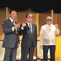 Philippines Ambassador Jose C. Laurel V (second from right), poses for a photo with (from left) Deputy Prime Minister and Finance Minister Taro Aso, Former Prime Minister Yasuo Fukuda and Nobuteru Ishihara, minister in charge of economic revitalization and chairman of the Japan-Philippines Parliamentary Friendship League, during a reception to celebrate of the 119th anniversary the Philippine\'s independence at Imperial Hotel, Tokyo on June 12. | YOSHIAKI MIURA