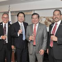 Jose Luis Varela (second from right), president of the Panama-Japan Inter-Parliamentary Friendship League, poses for a photo alongside (from left) Panama Ambassador Ritter Diaz, Seishiro Eto, president of the Panama-Japan Inter-Parliamentary League, and Ivan Picota, a member of the Panama-Japan Inter-Parliamentary Friendship League, during a cocktail party at the ambassador\'s residence in Tokyo on June 13. | YOSHIAKI MIURA