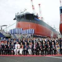 Guests pose for a photograph before Tsuneishi Shipbuilding Co., Ltd. launches a 63,700-ton vessel in celebration of its 100th anniversary on June 26 in the city of Fukuyama in Hiroshima Prefecture. | COURTESY OF TSUNEISHI SHIPBUILDING CO., LTD.
