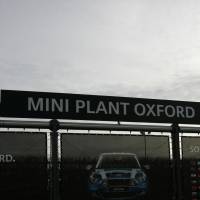 A large advertising poster for BMW Mini cars is seen outside the assembly plant in Oxford, England, in 2009. Germany’s BMW will make the electric version of its Mini compact cars at its factory in Oxford, a decision that comes at a time when automakers are scrutinizing investment plans due to Britain’s impending departure from the European Union. BMW picks Britain for assembling electric Mini despite Brexit
