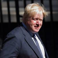 British Foreign Secretary Boris Johnson is seen in Downing Street in London last month. He arrived in Japan on Thursday for talks about trade and security issues. | BLOOMBERG