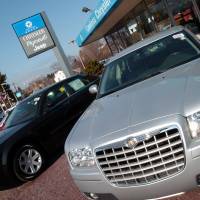 Chrysler 300s are lined up at a dealership in Woburn, Massachusetts, outside of Boston. | NEAL HAMBERG / BLOOMBERG