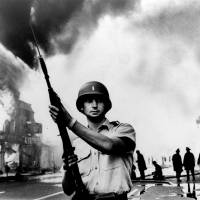 A National Guardsman stands at a Detroit intersection during July 1967 riots in the city. Detroit wasn\'t the first of the riots in the summer of 1967, and it was far from the last. Buffalo, New York, and Newark, New Jersey, preceded it; in the course of the summer, more than 150 cases of civil unrest erupted across the United States. | AP