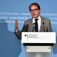 German Transport minister Alexander Dobrindt attends a news conference in Berlin on Thursday amid scandals around diesel emissions and a suspected carmaker’s cartel involving Germany’s top brands. German court rules in favor of diesel ban in Mercedes' hometown as fallout over VW scandal continues