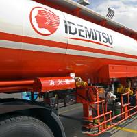 A tank truck driver prepares to pump out gasoline and other fuels into reserve tanks at an Idemitsu Kosan Co. gas station in Tokyo. What to expect at Idemitsu as acrimonious court battle looms
