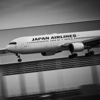 A Boeing 767 jet operated by Japan Airlines Co. prepares to land on runway 34L at Haneda airport in Tokyo. JAL posts 32.9% climb in group net profit for April-June quarter