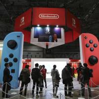 Nintendo Co. posted a group net profit of &#165;21.26 billion for the April-June quarter on the back of solid sales of its Switch game console and games. | AP