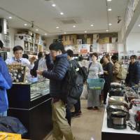 Tourists shop at Saga airport in Saga Prefecture. The transport ministry has selected a number of regional airports to take part in a tourism promotion incentive program. | KYODO
