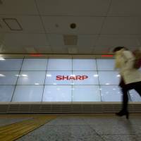 Sharp Corp. swung back into profit for the three months to June thanks to cost-cutting efforts under Taiwan\'s Hon Hai Precision Industry Co. | BLOOMBERG