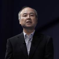 Masayoshi Son, chairman and chief executive officer of SoftBank Group Corp., speaks at the SoftBank World 2017 event in Tokyo on July 20. SoftBank reportedly planning direct bid for U.S. firm Charter Communications