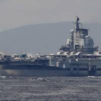 China\'s Liaoning aircraft carrier departs Hong Kong on Tuesday. | AP