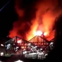 Camden Market is seen ablaze in London Sunday. | LUISDJLAUK &#8212; \"TWITTER@DJLAUK\" / HANDOUT / VIA REUTERS