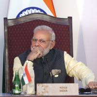 Indian Prime Minister Narendra Modi and Chinese President Xi Jinping listen to a speech during the BRICS summit in Goa, India, in October. India and China face off in border standoff as fears of all-out military conflict grow