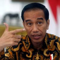 Indonesian President Joko Widodo gestures during an interview with Reuters in Jakarta Monday. Widodo upholds Indonesia as a model of moderate Islam despite extremist undercurrents