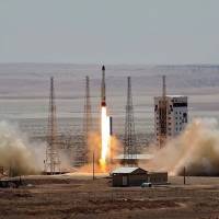 A Simorgh rocket is launched and tested at the Imam Khomeini Space Centre, Iran, in this handout photo released by Tasnim News Agency on Thursday. Iran claims success in launch of satellite-carrying rocket into space