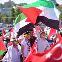 Protesters wave Turkish and Palestinian flags during a demonstration in Istanbul on Sunday to protest measures taken by Israel in Jerusalem and to show solidarity with the Palestinians. Israel had angered Turkey by installing metal detectors and security cameras after a July 14 attack near the Haram al-Sharif holy site in Jerusalem, known to Jews as the Temple Mount, in which gunmen killed two policemen. The move sparked Muslim protests and deadly unrest, and the Israeli government removed the detectors on July 25 as well as the cameras. Turkey party brings in 5,000 to stage Istanbul protest over Israeli security steps at Jerusalem mosque