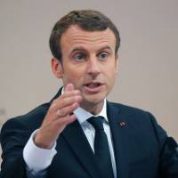French President Emmanuel Macron delivers a speech during a citizenship ceremony in Orleans on Thursday. Sources say Russia used Facebook accounts in attempt to spy on Macron campaign