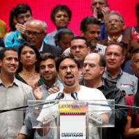 Freddy Guevara, first vice-president of the National Assembly and lawmaker of the Venezuelan coalition of opposition parties (MUD), talks to the media during a news conference in Caracas Monday. | REUTERS