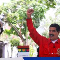 Venezuelan President Nicolas Maduro gestures while he speaks during his weekly broadcast \"Los Domingos con Maduro\" (\"The Sundays with Maduro\") in Caracas Sunday. | MIRAFLORES PALACE / HANDOUT / VIA REUTERS