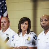 Minneapolis Police Chief Janee Harteau stands between Police Inspector Michael Kjos (left) and Assistant Chief Medaria Arradondo during a news conference in the city Thursday. Minneapolis police chief steps aside in wake of shooting of unarmed Australian woman