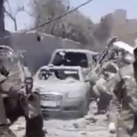 This photo made from undated video posted online shows a man in an Iraqi Army uniform moments before shooting an unarmed man in Mosul, Iraq. Human Rights watch issued a statement Thursdayon four videos uploaded to social media purportedly showing Iraqi forces killing and beating men suspected of being Islamic State group fighters. Videos appear to show Iraqi forces in Mosul beat, kill prisoners: HRW