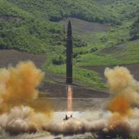 This July 4 photo distributed by the North Korean government shows the launch of a Hwasong-14 intercontinental ballistic missile (ICBM) in North Korea. North Korea’s nuclear and missile development programs have without doubt come at a severe cost. Even so, the North has managed to march ever closer to having an arsenal capable of attacking targets in the region and — as demonstrated by its July 4 ICBM test launch — the U.S. mainland. U.S. officials now believe North Korea will have ICBM capable of carrying nuclear warhead by next year