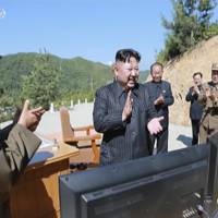 This image made from video of a news bulletin aired by North Korea’s KRT on Tuesday shows what was said to be North Korea leader Kim Jung Un (center) applauding after the launch of a Hwasong-14 intercontinental ballistic missile in North Korea’s northwest. Independent journalists were not given access to cover the event depicted in this photo. North Korea's provocations seen as tactic to gain U.S. concessions