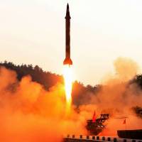 A North Korean ballistic missile is test-fired from an undisclosed location in this undated photo. North Korea uses 'lofting' technique to bring it ever closer to long-range missile goal