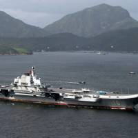 China\'s aircraft carrier, the Liaoning, sails into Hong Kong July 7. | REUTERS