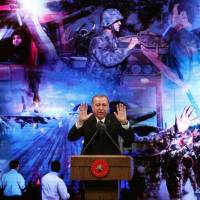 Turkish President Recep Tayyip Erdogan speaks during a ceremony marking last year’s failed coup at the Bestepe People’s Culture and Congress Center in Ankara on Thursday. A year after attempt to oust Erdogan, crackdown shakes pillar of Turkish state